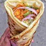 freshly made kathi roll with chutney and onions