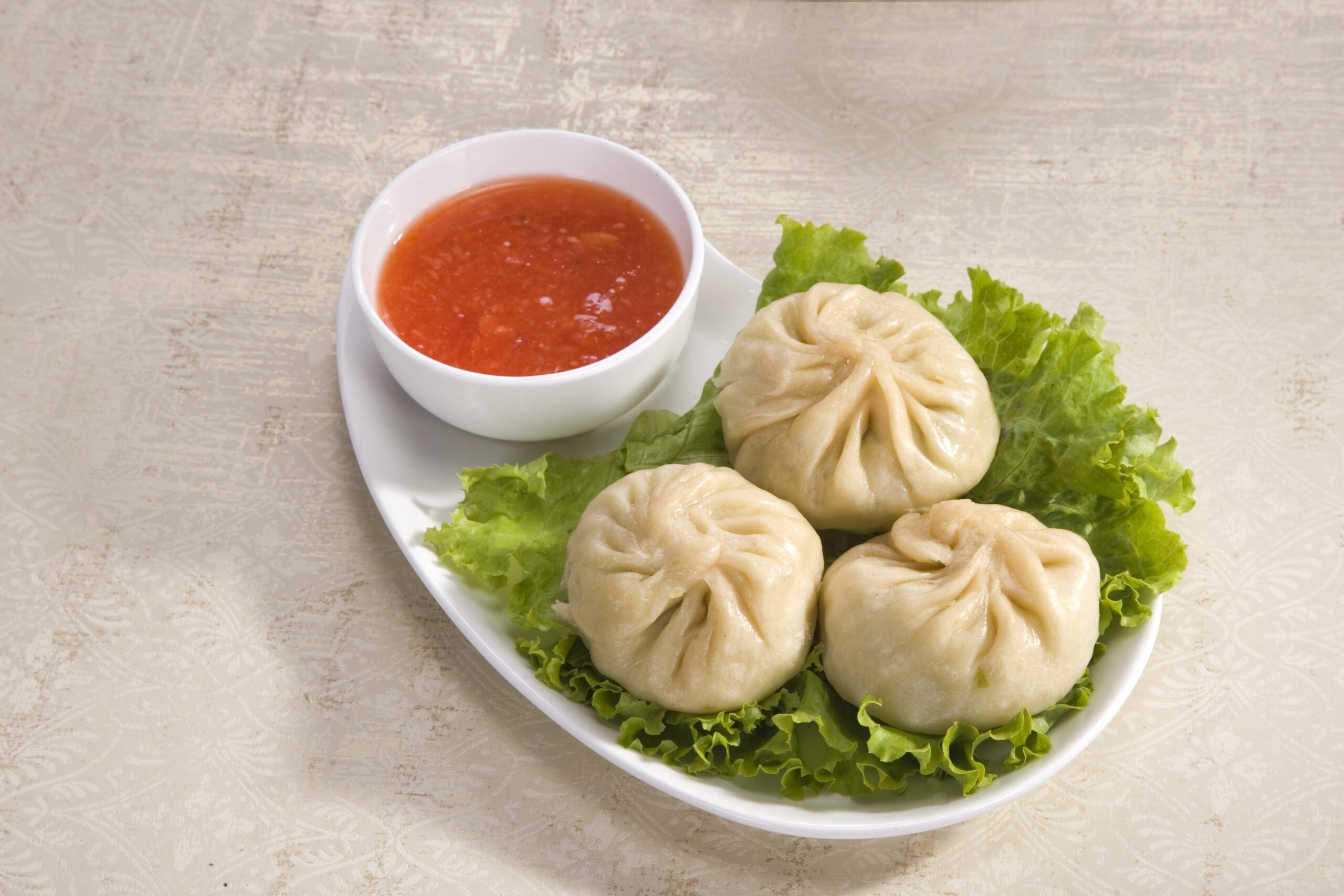 Steam Momos served hot with chutney in Delhi NCR
