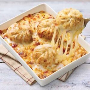 Cheese Gravy Momos in creamy cheese sauce