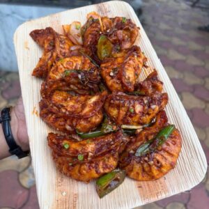Garlic Chilli Momos tossed in spicy garlic sauce
